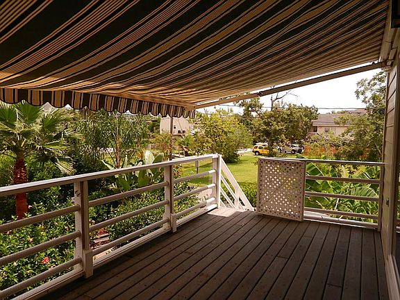 Great front porch with electric Sunbrella