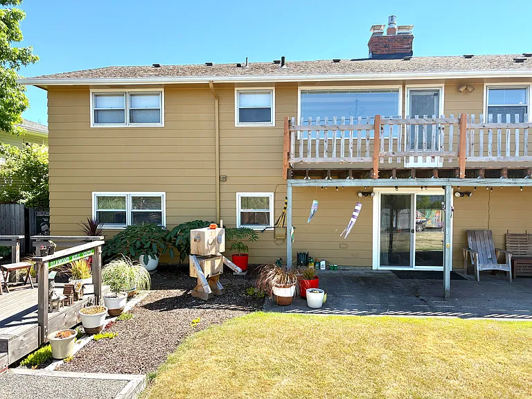 two separate entrances into backyard for main floor apartment and basement apartment