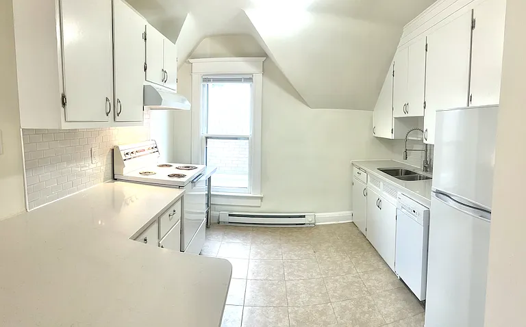 Lots of cabinet storage, all appliances, eat in kitchen at counter.
