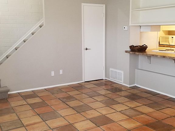 Family room with kitchen and dining area to right side.