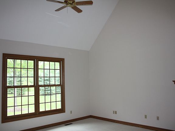 2 story Library with vaulted ceiling