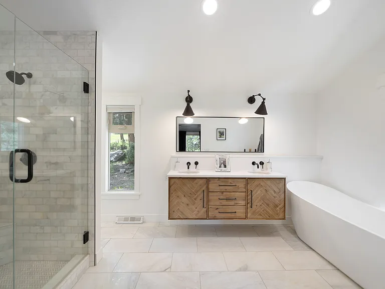 Primary bath on main level with, stand alone tub, dual vanity and dual shower.