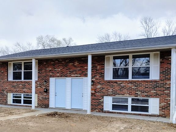 The left side looking a the picture is 218. There is a sidewalk that leads from the road to the unit.