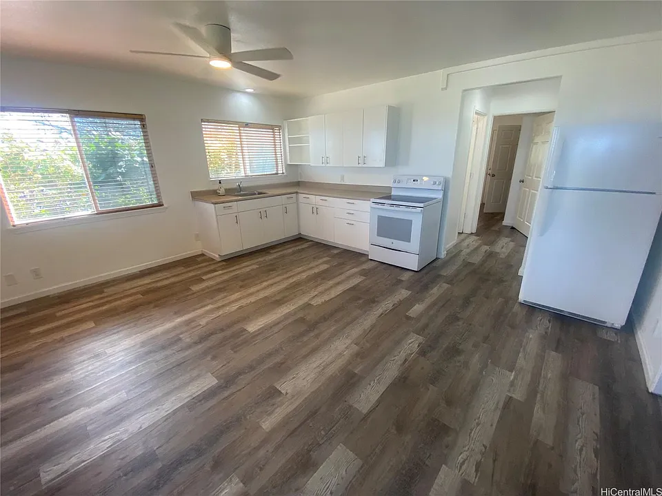 Open foor plan, new kitchen with new flooring.