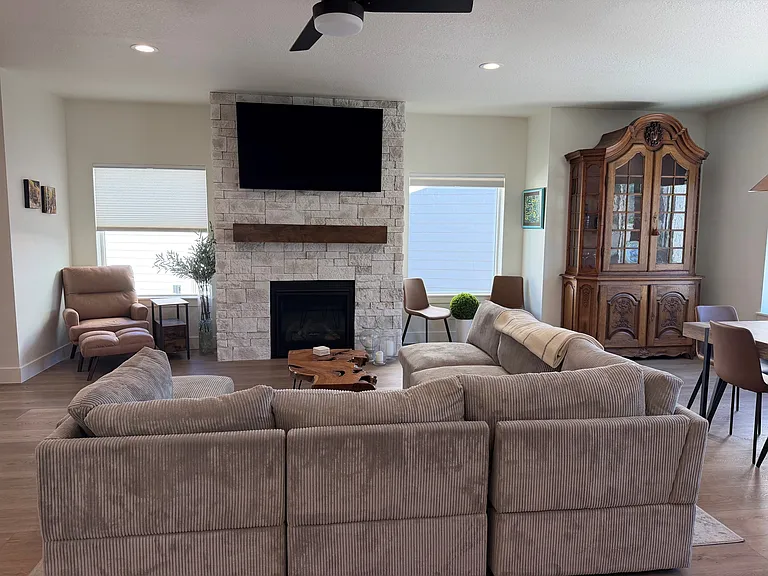 Great room with comfy sectional couch, multiple seating areas