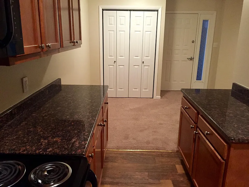 Kitchen facing Entrance and Coat Closet