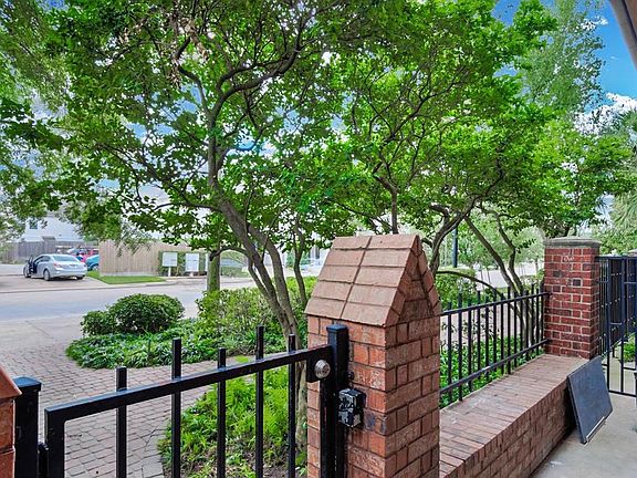 GATED FRONT PORCH: Amazing space for sitting out in the morning or working from home and meeting with clients. Convenient street parking directly in front of the unit.