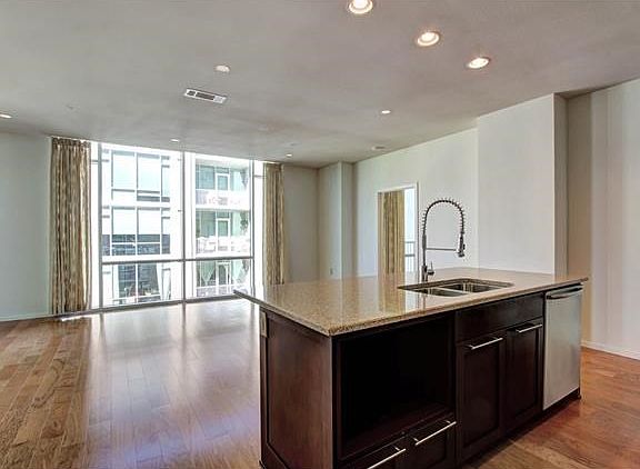 Kitchen open to large living area - tons of beautiful, natural light!