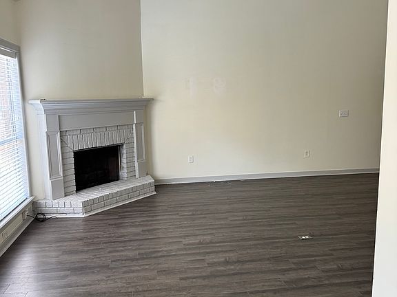 den with vaulted ceilings with gas fireplace