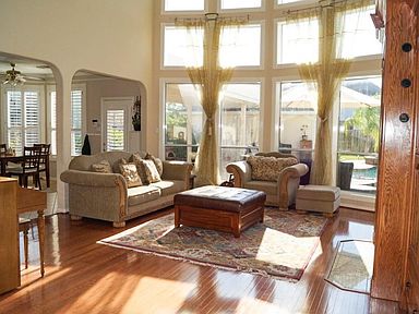BEautiful wall of windows lets the natural light in to this beautiful two story family room