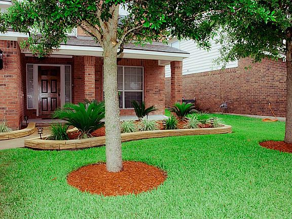 Beautiful landscaping in the front and back of the home.