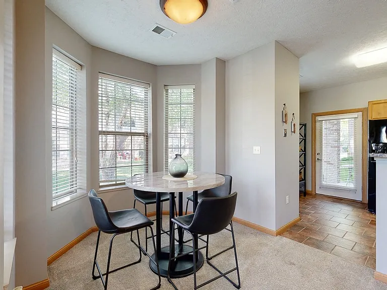 Enjoy a bright dining nook with a bay window that bring in natural light, perfect for casual meals or entertaining guests.