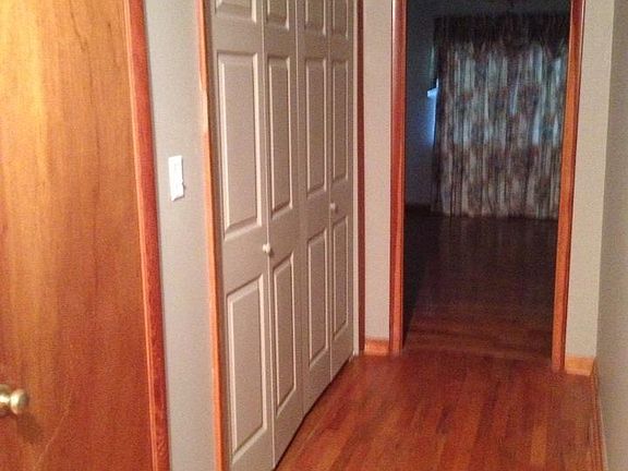 hall with laundry closet