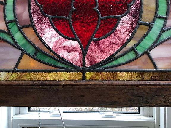 One of several antique stained glass windows that let in the natural light while protecting your privacy.