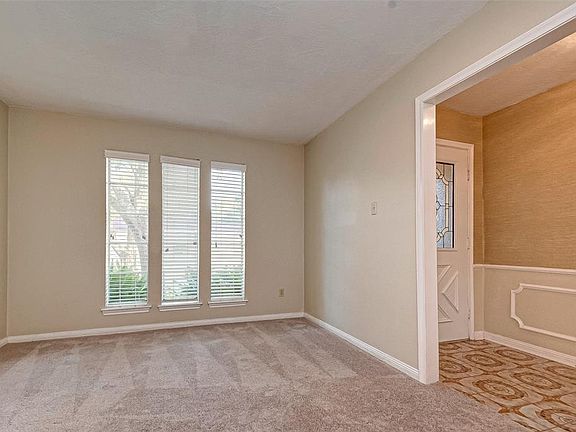 A traditional formal living room is on the right side of the front entry as you enter the home