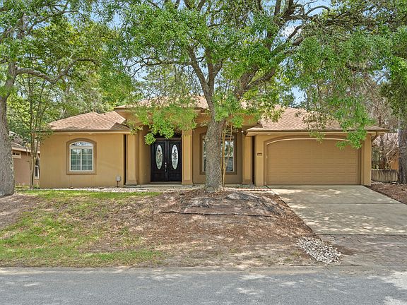 Tuscan-style home with double garage.
