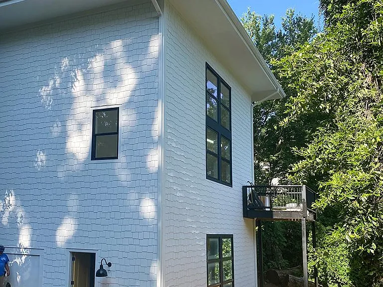 The apartment is on the bottom of the house.