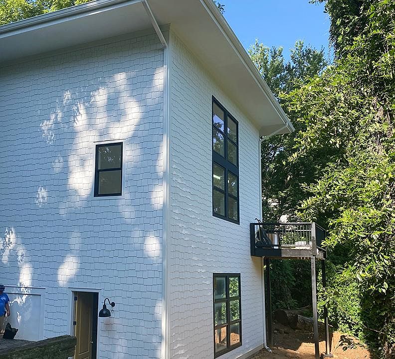 The apartment is on the bottom of the house.