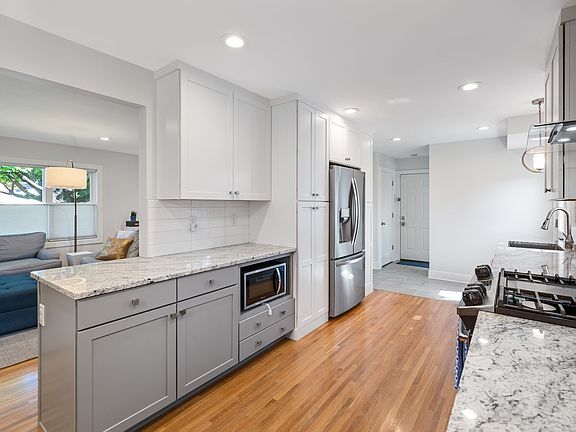 Kitchen has a nice opening toward main floor living room.