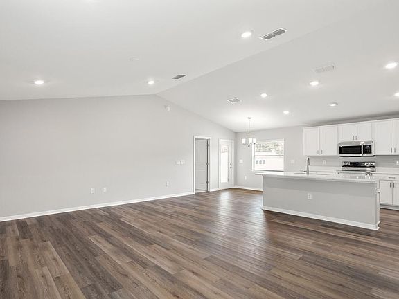 Enjoy a sunny, open layout with low-maintenance LVP flooring.