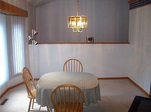 Dining Room: Formal Dining Room with vaulted ceiling.