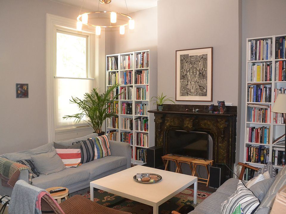 Living room has original fireplace surround