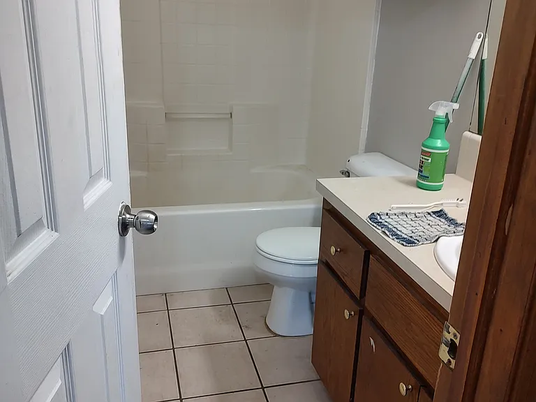 Restroom with storage above and below