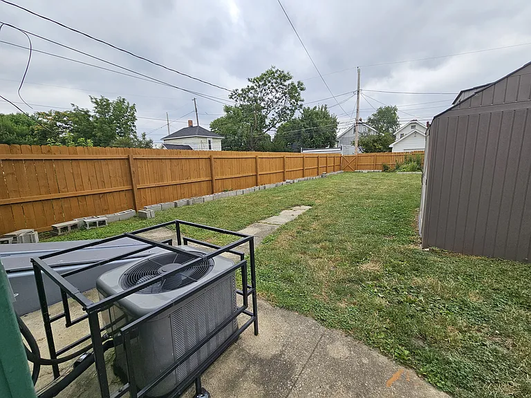 Full privacy fence in backyard plus 10x12 storage shed