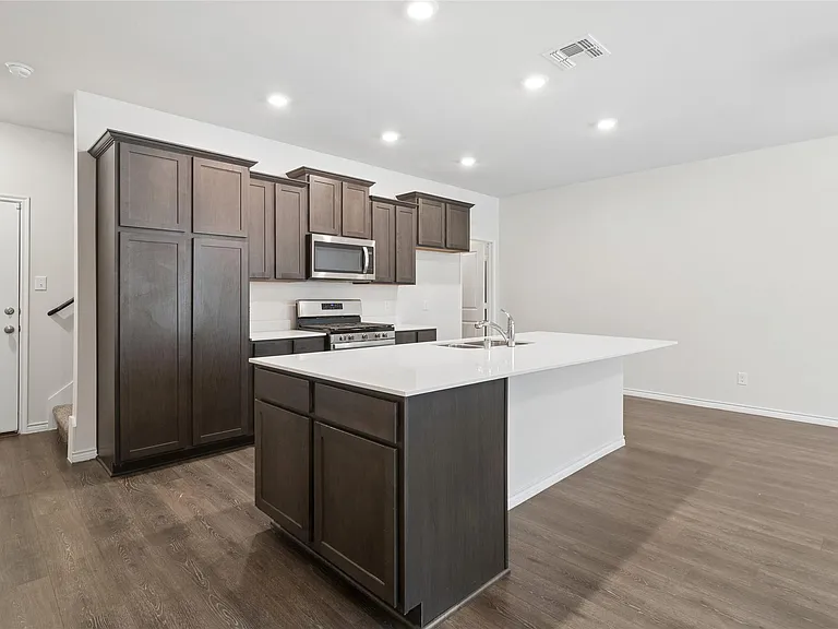 Wood flooring throughout the spacious downstairs area