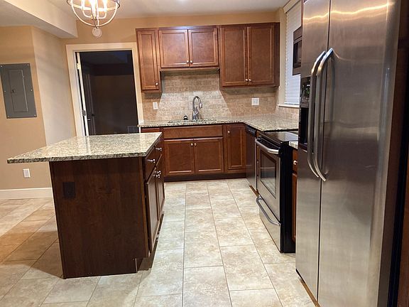 Large Kitchen with Granite Counter tops and island