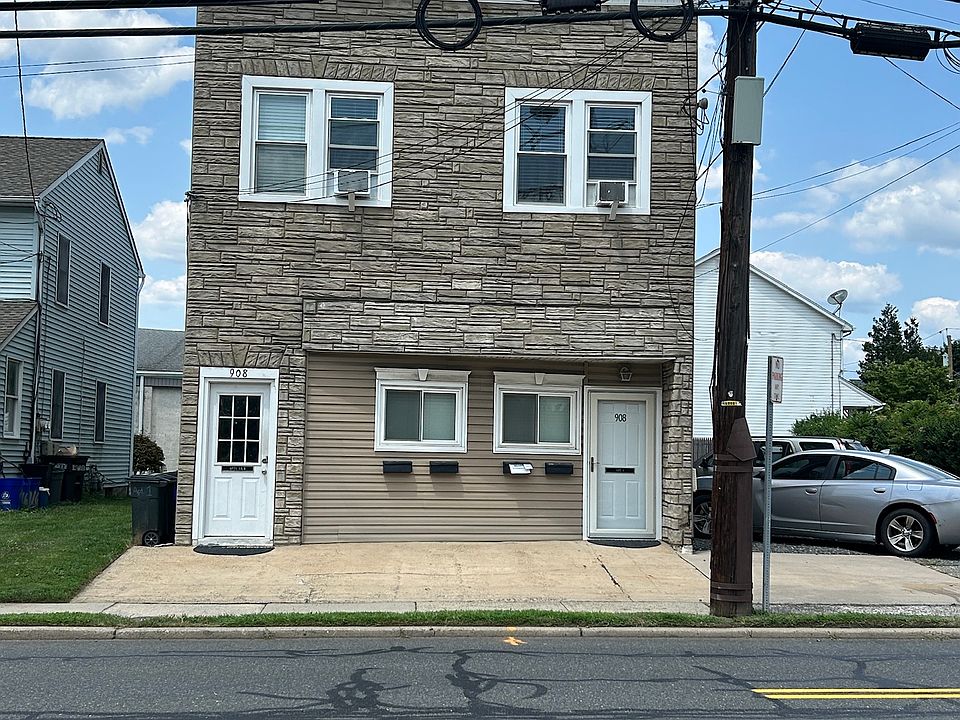 Front of building. Unit entrance is first floor, right-side door.