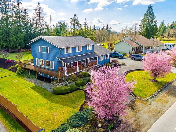 Another view of this wonderful property. Wrap around deck!
