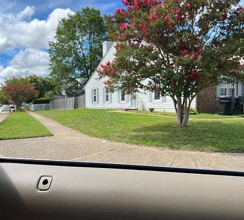 Great location on corner setting next to single family homes