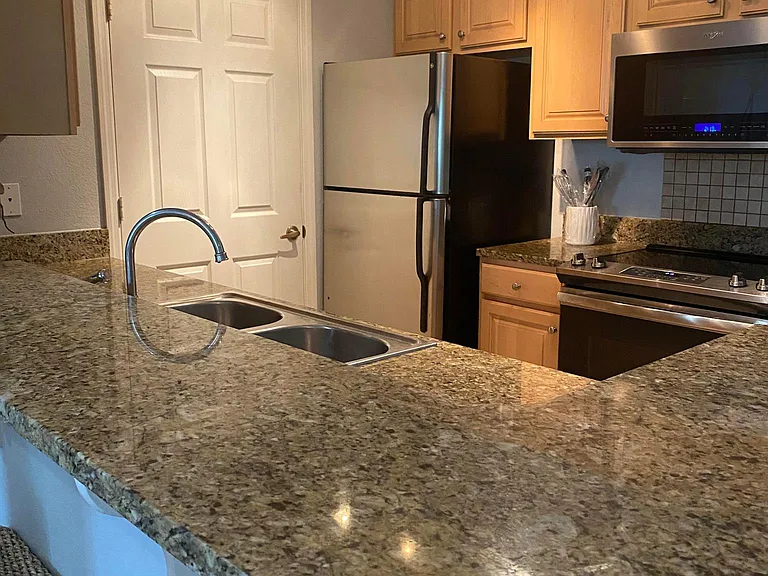 Kitchen Area- Space for Bar Stools, Granite Counter Tops, Stainless Steel Appliances
