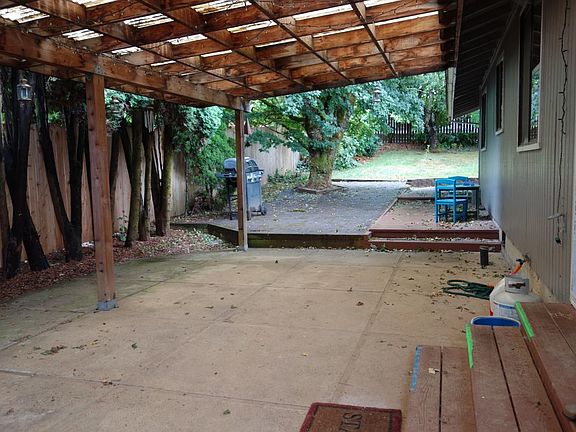 Patio off of dining room and deck off of rear bedroom