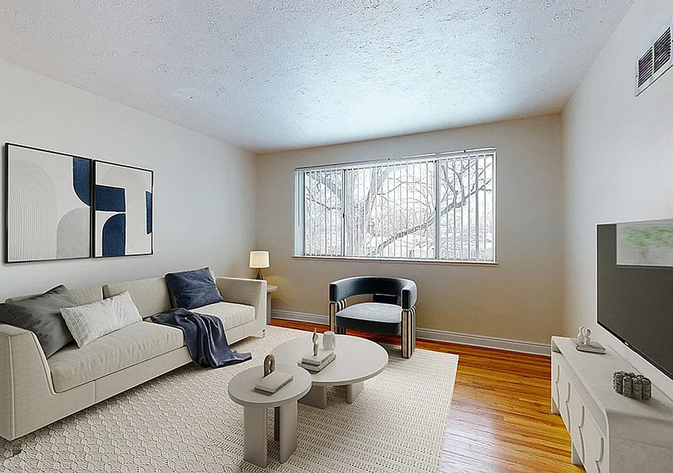Bright and inviting living room with modern furniture, large window, and chic decor.