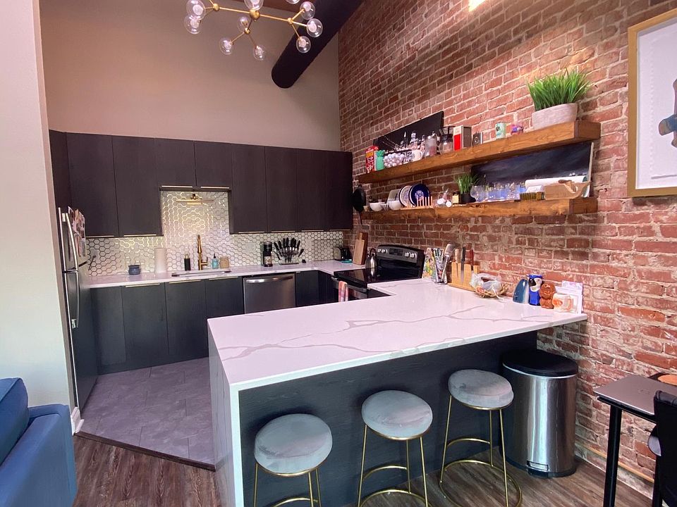 Fully remodeled kitchen with plenty of countertop space and seating