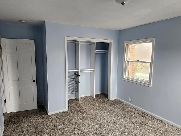 One of the 4 bedrooms upstairs. Ample 8x8 closet. brand new carpet