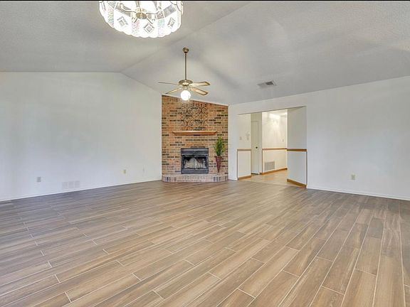 living room with wood burning fireplace