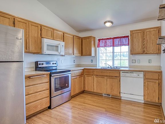 Low maintenance laminate flooring grace the kitchen. Ample cabinetry provide for lots of storage.