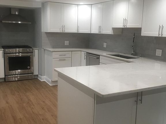 Terrific kitchen for a rental (more upscale than most condos). Hardwood floors throughout