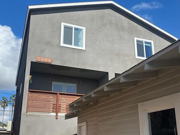 Unit's private patio and separate side entrance