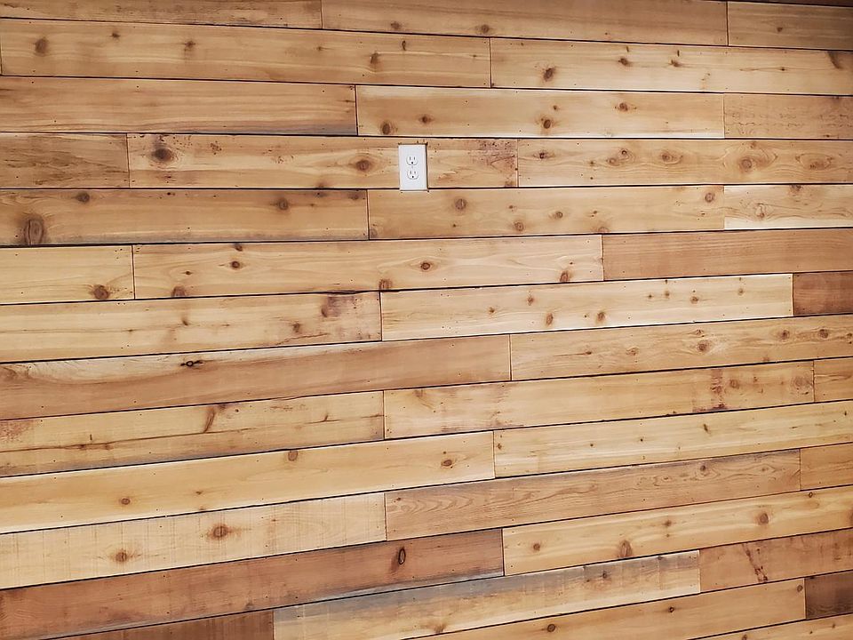 Front door / wood accent wall in living area