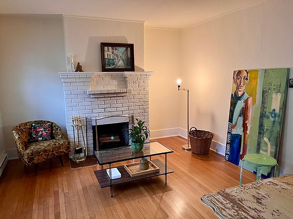 Living room with working fireplace (furnishings not included)