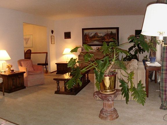 A beautiful bay window provides a picturesque view in the large living room
