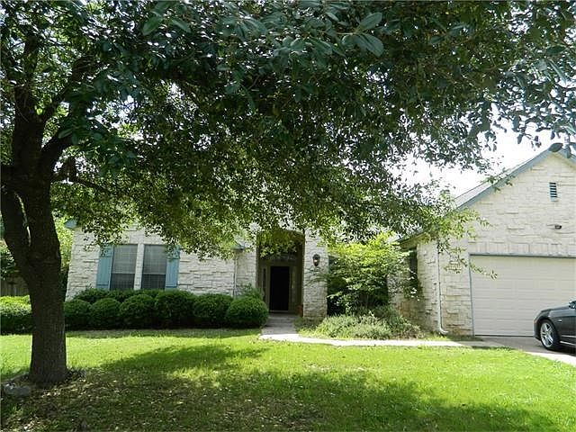 front elevation. House backs up to ranch land, so no neighb