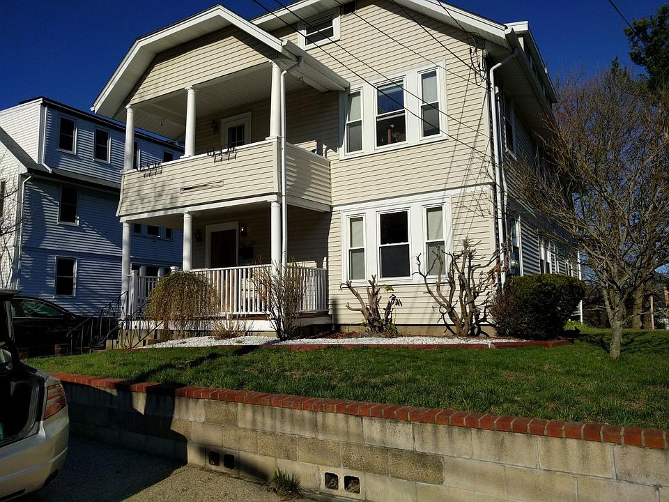 Street view. Parking is off-street side to side behind the house.