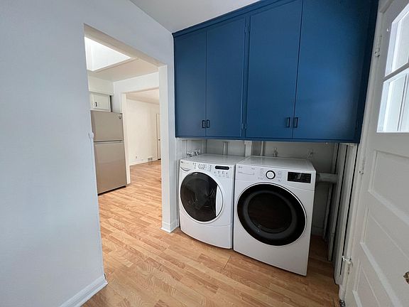 Full size laundry, door to fenced in backyard.