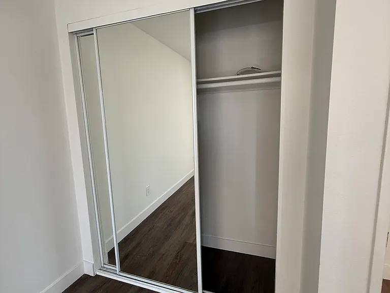 Closet with sliding mirror doors