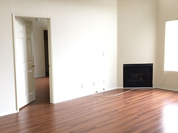 Airy living room with high ceilings and fireplace